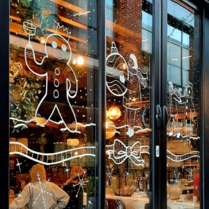 Christmas window illustration for Ask restaurant in Stratford-upon-Avon Christmas themed illustration on a restaurant window