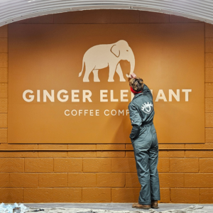 Simple and effective handpainted logo and lettering for a coffee roasting company Large handpainted logo mural for a coffee company