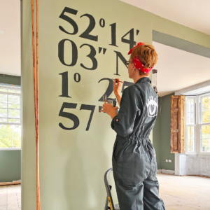 Hand-lettered mural for The Great Western pub showing latitude and longitude of the venue